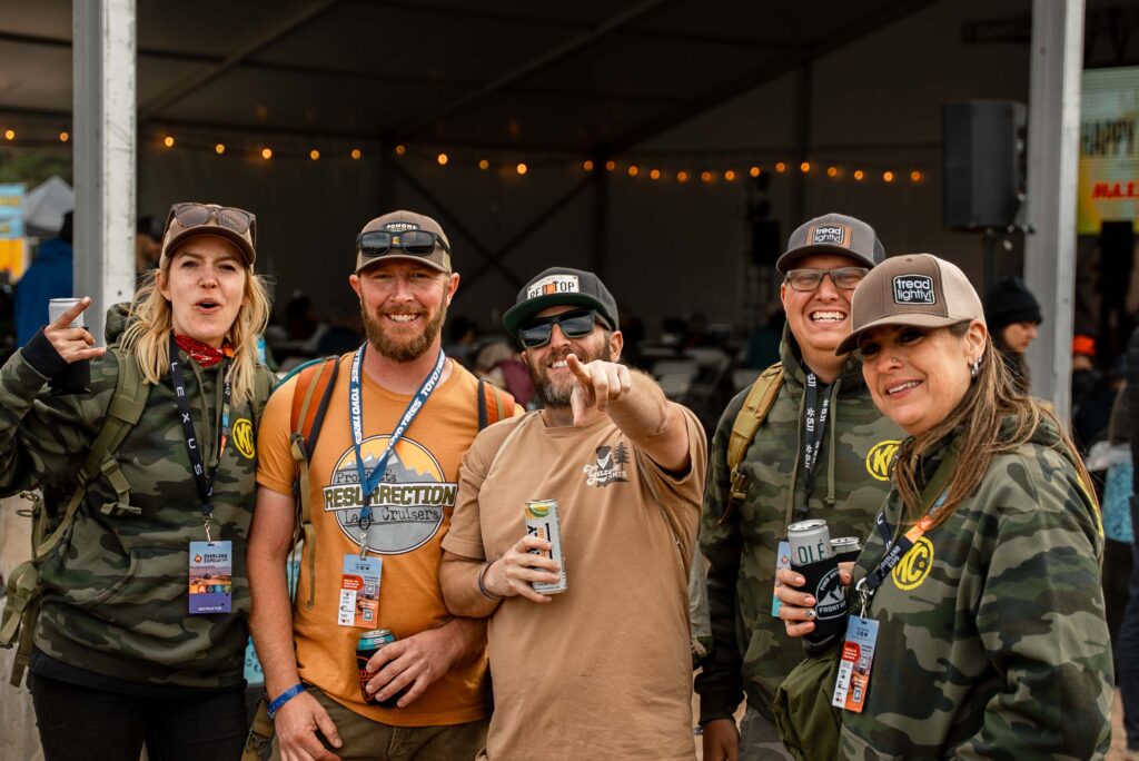 A group of people celebrating the After Hours Fun at Overland Expo