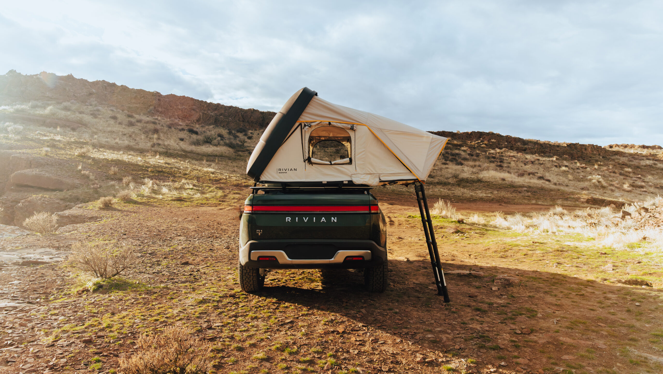 the new iKamper x Rivian skycamp mini rooftop tent is the perfect addition to a Rivian with a sleek, aerodynamic design and maximum comfort.